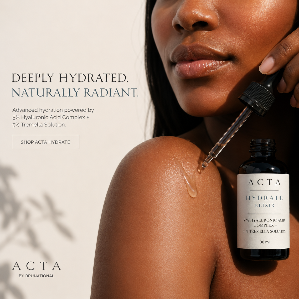 Woman applying ACTA Hydrate Elixir to her shoulder with a dropper, against a neutral background.